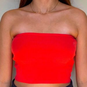 Right pink/red tube top.